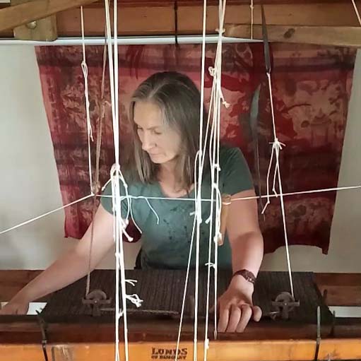 Weaver working at her loom at home in Kilcar, County Donegal.