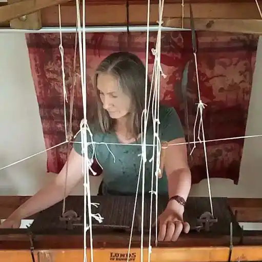 A woman weaver works at her loom in Kilcar, County Donegal.